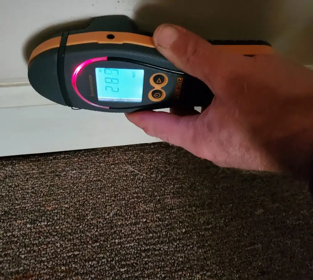 Moisture detection at baseboard during Storm Damage Restoration in Lathrop